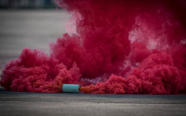 istock colorful pink smoke bombs action in showing 1127899814
