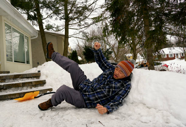 istock Man fell with snow shovel 1127899840
