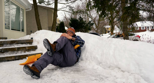 istock Man fell with snow shovel 1127899850