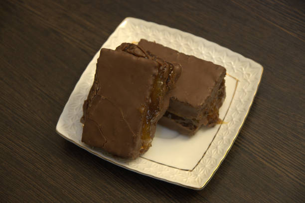 istock Chocolate sponge cake on white porcelain plate. 1127901626