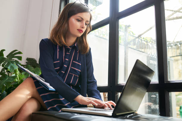 istock Female entrepreneur working on laptop 1127907004