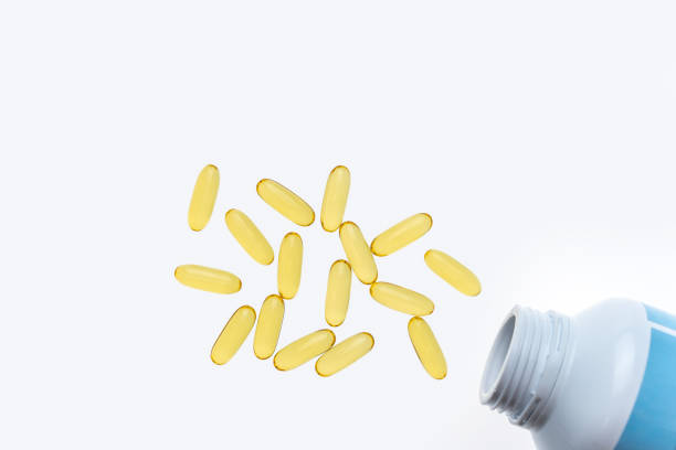 istock The cod liver oil capsules isolated on white background. Cod liver oil is a dietary supplement derived from liver of cod fish (Gadidae). 1127908246