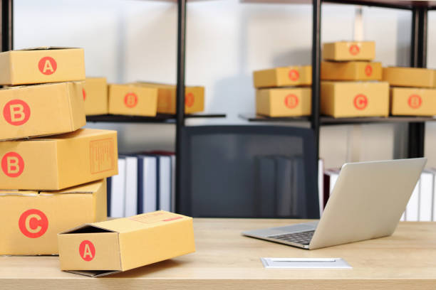 istock Cardboard box on workplace at home. Start up small business. 1127908373