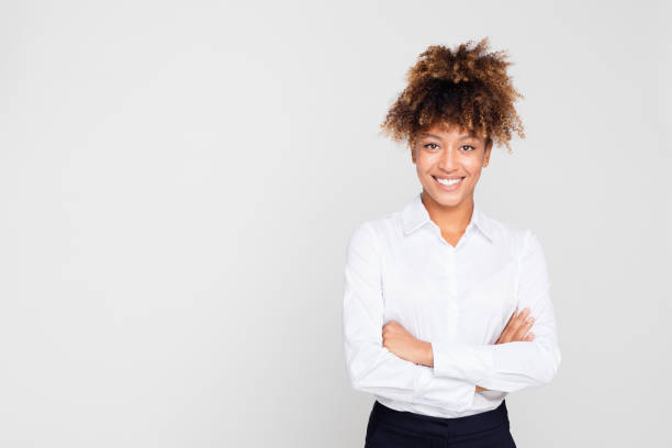 istock Afro american businesswoman standing confidently 1127908601