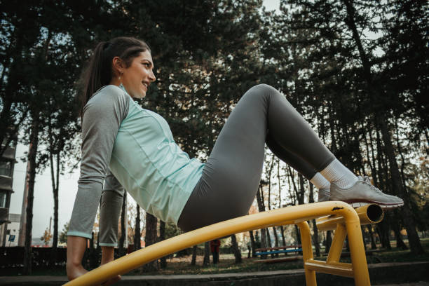 istock Woman training outdoors in the park on a sunny day 1127908785