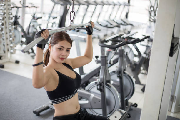 istock Confident Young Woman Exercising In Gym 1127909528