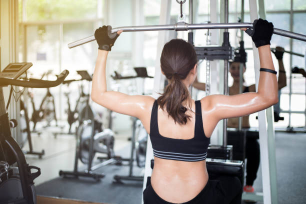 istock Young Woman Exercising In Gym 1127909536