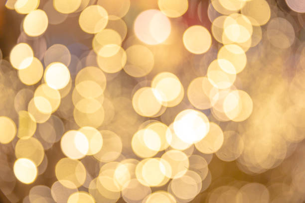istock Golden Glittering Bokeh Background 1127911835