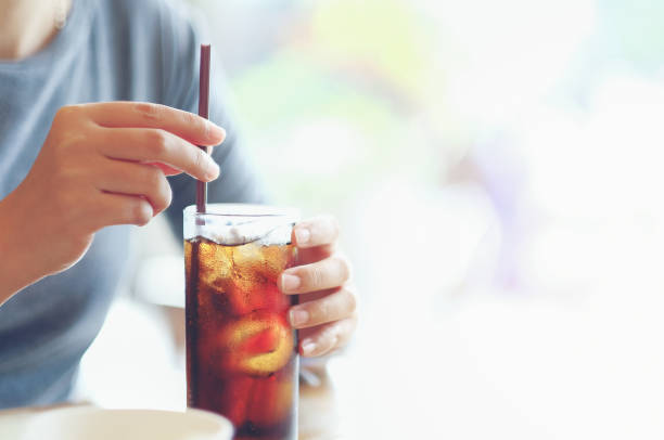 istock Midsection Of Woman Having Drink In Restaurant 1127911861