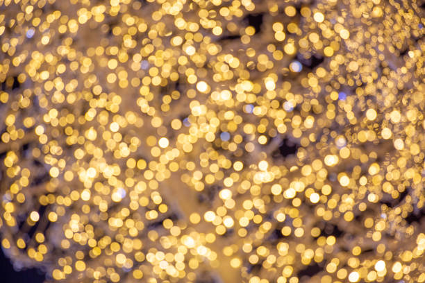 istock Golden Glittering Bokeh Background 1127912907