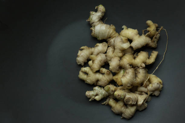 istock Ginger on black plate for food content. 1127915380