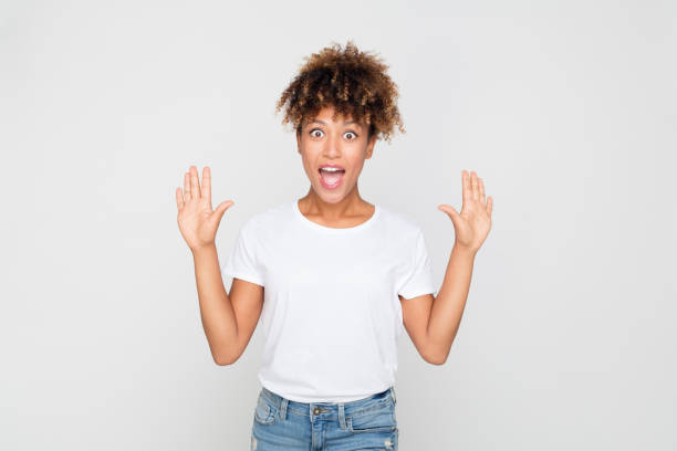 istock Young afro american woman looking amazed 1127917561