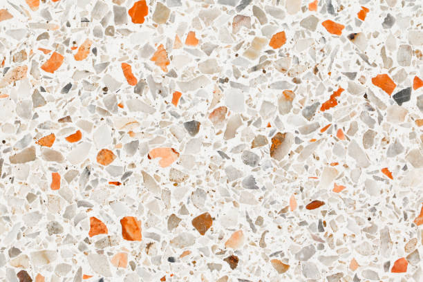 istock terrazzo flooring which has Orange rock Small or marble old. polished stone wall beautiful texture for background with copy space add text 1127918040