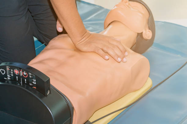 istock CPR aid dummy medical training with hand press Heart on doll emergency refresher training Concept closed-up. 1127918254