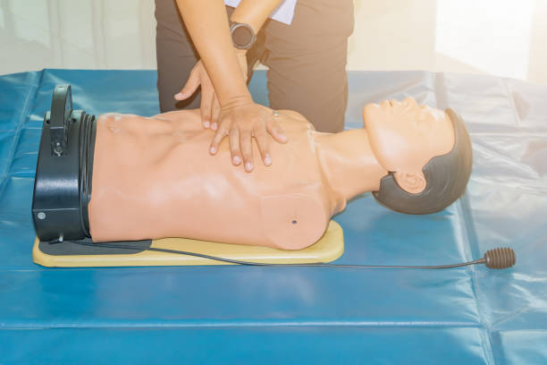 istock CPR aid dummy medical training with hand press Heart on doll emergency refresher training Concept closed-up. 1127918263
