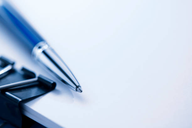 istock Ballpoint Pen Resting On Top Of Stack Of Documents 1127919252