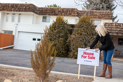 American Female In Residential Housing Townhome for Sale Area in Western Colorado, Grand Junction - For Sale Sign Created by Photographer for shoot (photos professionally retouched and downsampled as needed for clarity - Lightroom / Photoshop - original size 8688 x 5792 canon 5DS Full Frame)