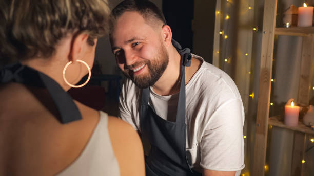 istock couple looking at each other in clay studio 1127926018