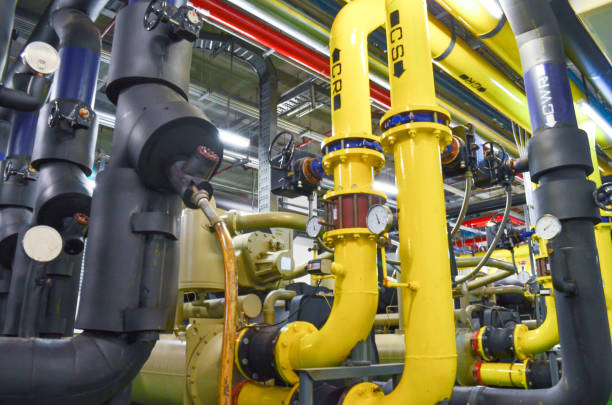 istock Pumping station and Electrical power generator  industrial interior pipes line in large building 1127929345