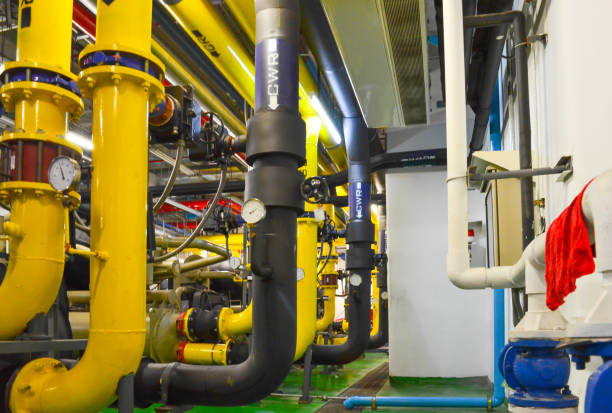 istock Pumping station and Electrical power generator  industrial interior pipes line in large building 1127929378
