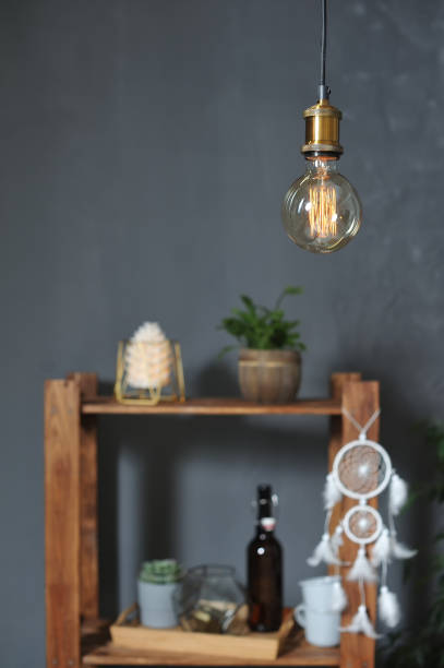 istock Round and big Edison's Lamp on a gray background. 1127932844
