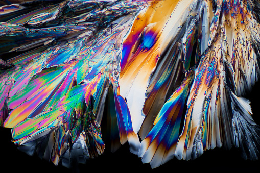 Colorful sugar crystals under the microscope using polarized light