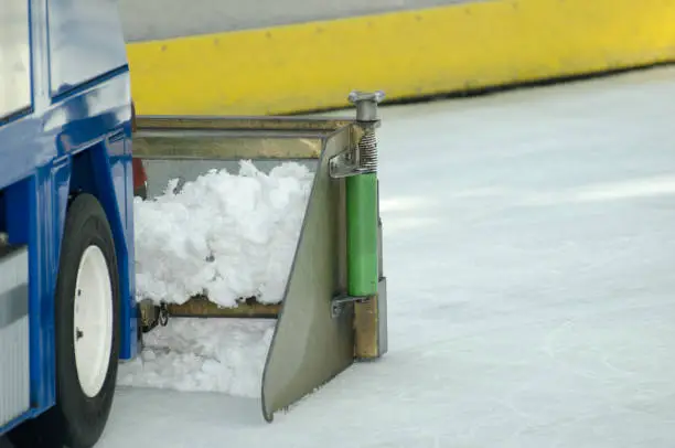 A skating rink cleaning machine prepares the ice in a skating rink