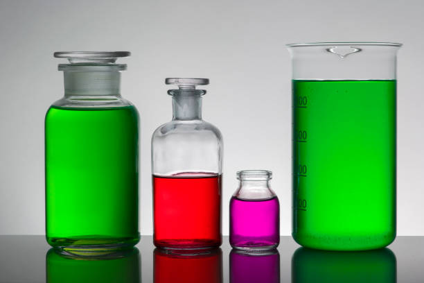 istock Liquid in laboratory bottles. Scientific biochemical laboratory. Colorful liquid. Isolated on white background,  a group of bottles. Test tubes. 1127934321