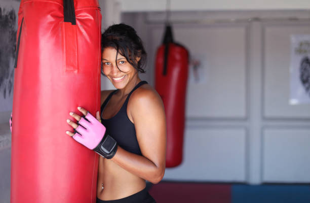 istock a Young woman training for combat sports. 1127934569