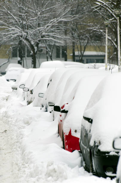 istock Cars covered in snow 1127934818