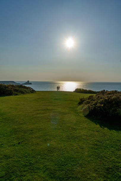 Couple in silhouette at the Gower coast