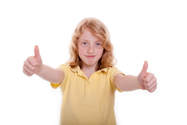 istock Small girl holds up the thumb 1127935596