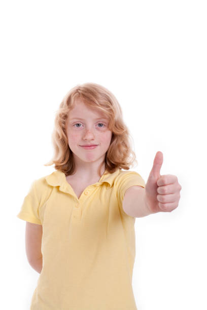 istock Small girl holds up the thumb 1127935599