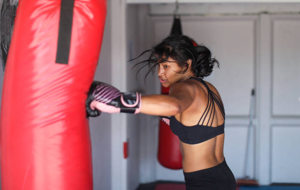 istock a Young woman training for combat sports. 1127935914