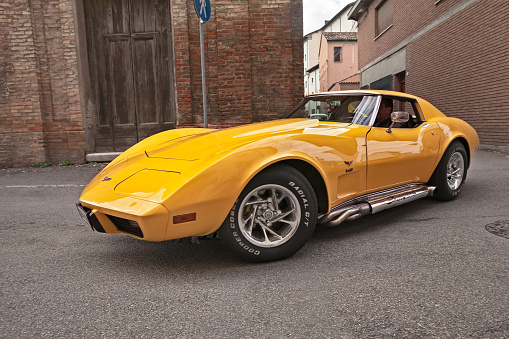 classic American sports car Cheevrolet Corvette C3 Stingray of the seventies with side pipes exhaust in 24th Meeting auto vintage in November 11, 2018 in Bagnacavallo, RA, Italy