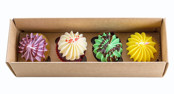 4 cupcakes colorful  in the box. cupcake in a paper box on white background.