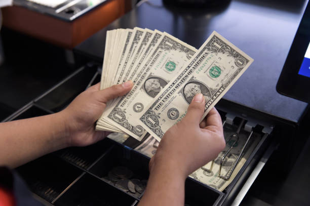 istock High angle view of cashier 1127939734