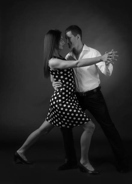 istock Couple in love dancing in the Studio. 1127941002