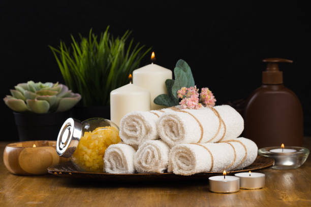 istock Spa still life with aromatic candles, flower and towel. - Image 1127942684