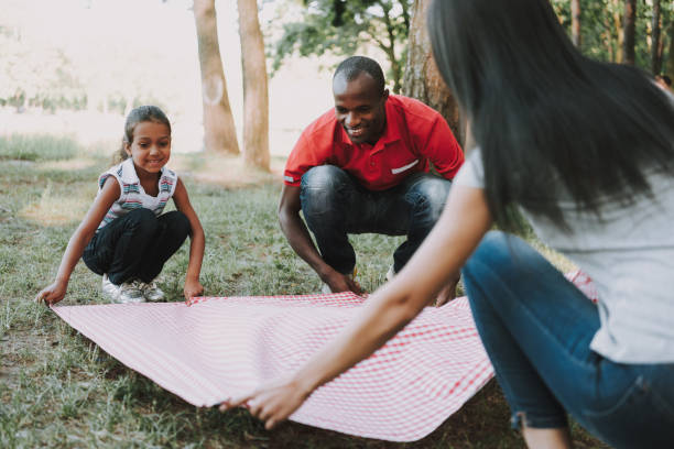 istock Multinational Family Spread Tablecloth For Picnic. 1127942964