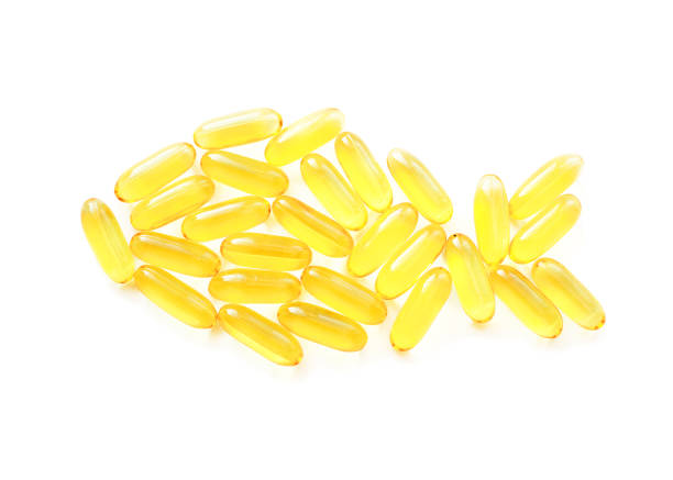 istock Fish oil capsules in shape of fish 1127944976