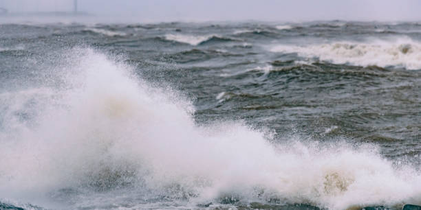 istock Waves hitting a levee at the IJsselmeer during a storm 1127945832