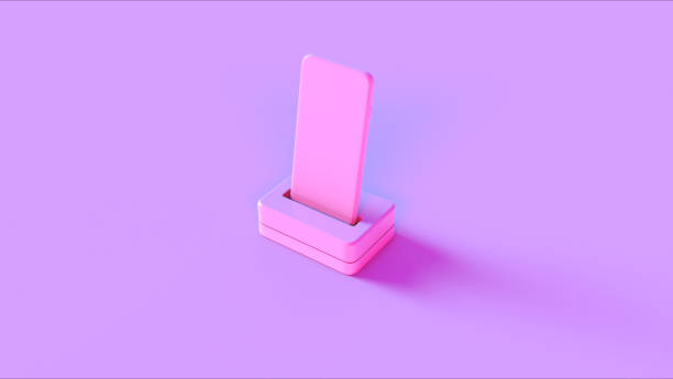 istock Pink Mobile Phone and Charger 1127946042