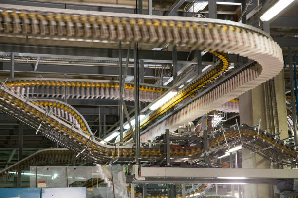 istock Conveyor belts with newspapers in printing press 1127947506