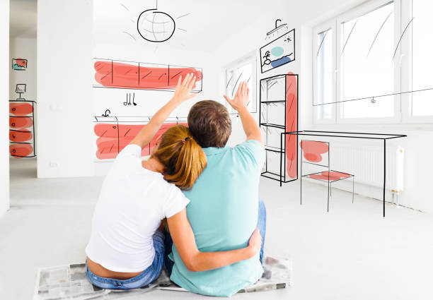 couple at their new empty apartment stock photo