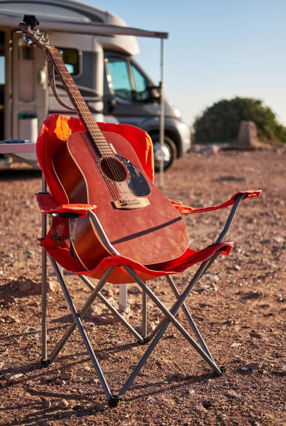 istock Acoustic guitar on a folding chair 1127949232