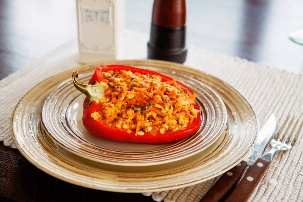 Stuffed bell pepper with minced turkey meat, carrots, onions and oven baked. Hay diet, keto diet, low carb diet recipe. stock photo