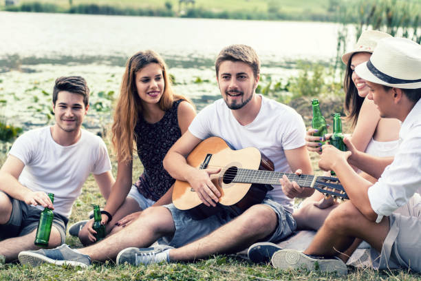 istock Happy Young people having party outdoor 1127950755
