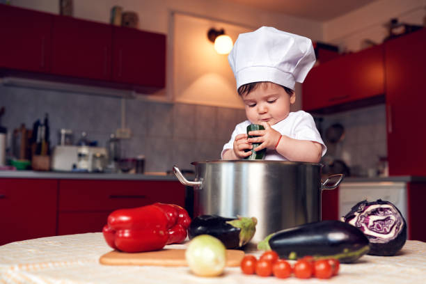 istock funny girl inside pot in the kitchen 1127951071