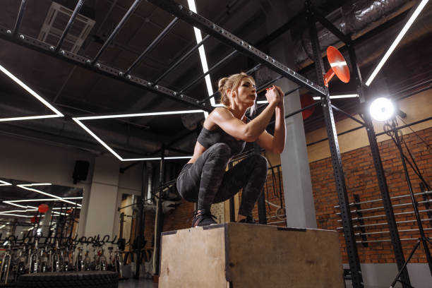 istock gym exercise roitine. side view full length photo 1127952249